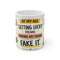 Funny Coffee Mug – “At My Age ‘Getting Lucky’ Means Finding My Phone” Ceramic Gift
